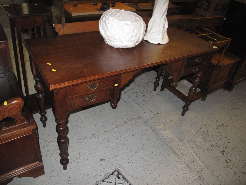 20th Century oak knee hole desk on baluster turned legs and fitted drawers.