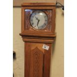 Bentima 8 day modern grandmother clock in oak narrow case.