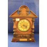 Early 20th Century presentation mahogany architectural two train enamel face mantle clock