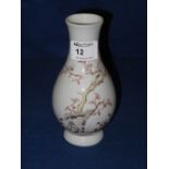 Chinese porcelain baluster shaped vase overall painted with foliage and butterflies on a white