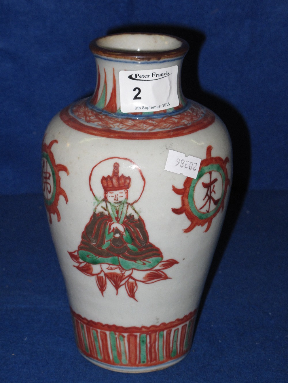 Chinese Stoneware porcelain baluster shaped vase decorated with seated praying figures and having
