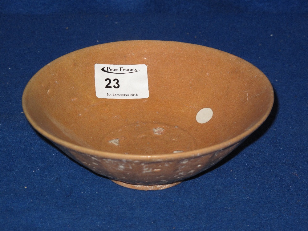 Provincial Chinese shallow rice bowl with solid tan glaze.  Interior stilt marks.  Unmarked.