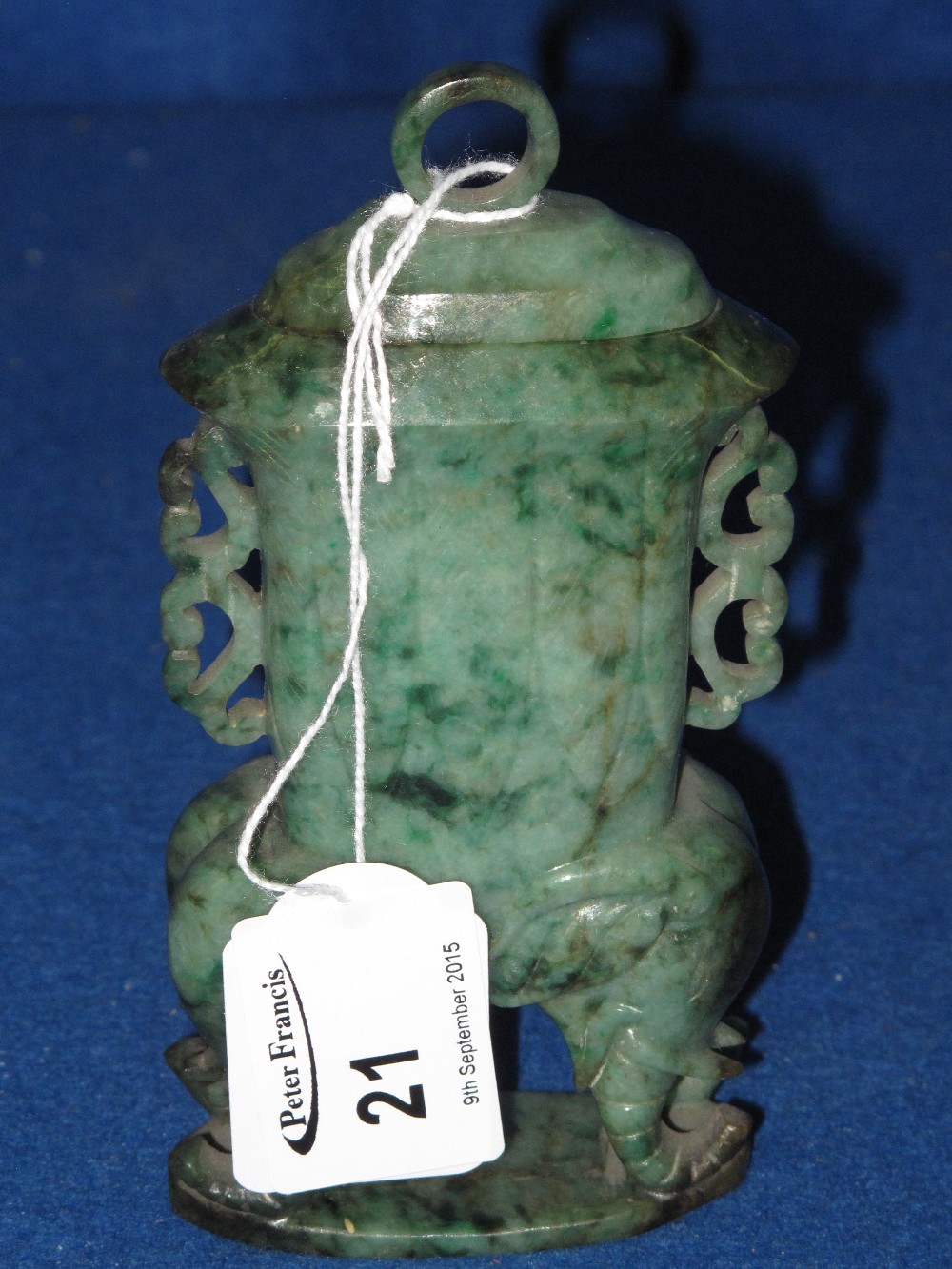 Chinese carved green hard stone solid urn with loop to domed top on elephant legs.  Probably jade.