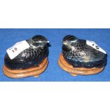 Pair of carved hard stone jars and covers in the form of quail on wooden bases. (2) CONDITION