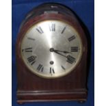 Early 20th Century mahogany cased three train mantel clock with silvered face.