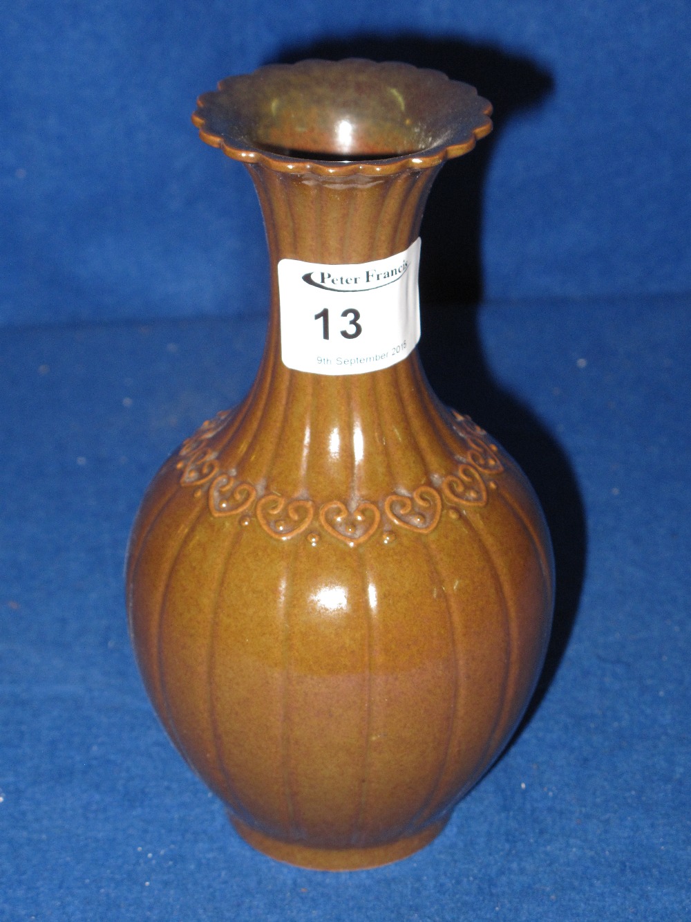 Chinese porcelain fluted baluster shaped vase with flared neck and relief band decoration.