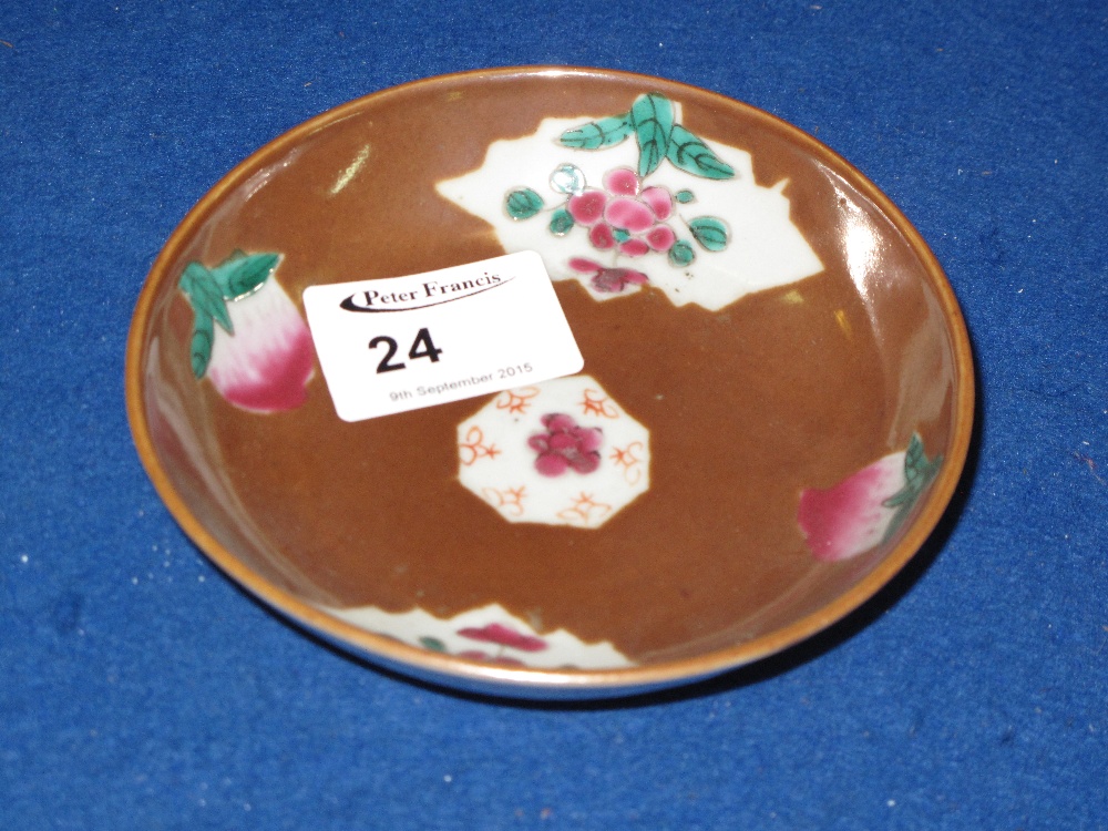 Small Chinese porcelain dish overall decorated with green enamelled floral designs in reserve panels