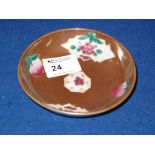 Small Chinese porcelain dish overall decorated with green enamelled floral designs in reserve panels