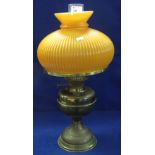 Brass double burner oil lamp with over-lay glass orange fluted shade and clear chimney.