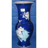 Chinese porcelain blue ground baluster shaped vase decorated with an immortal figure standing on a