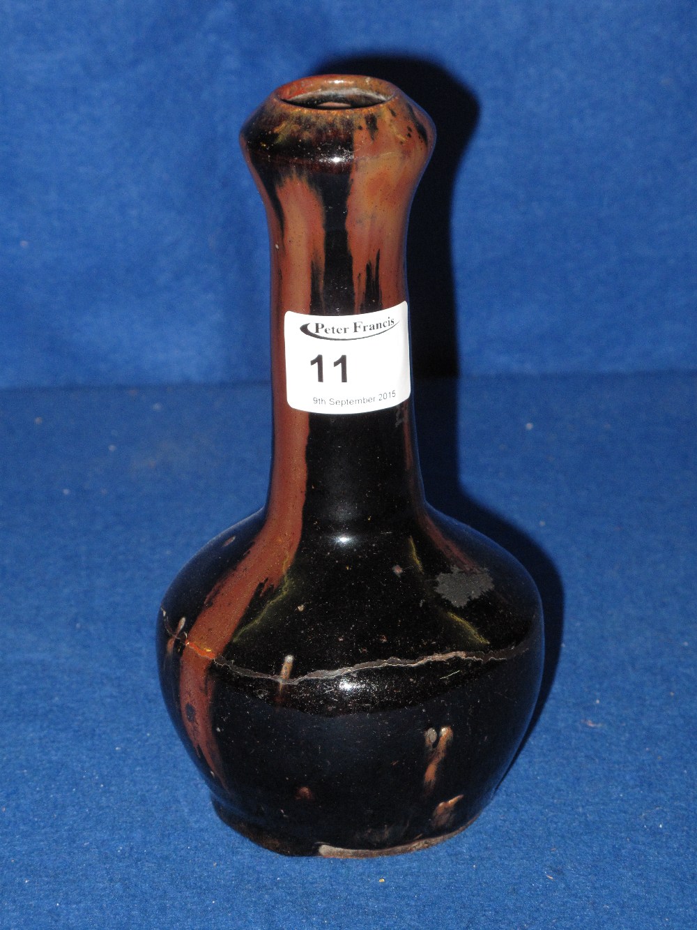 Chinese provincial Stoneware garlic bulb vase with overall brown and black streaked glazes.