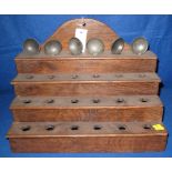 Traditional Welsh pine four stage spoon rack, together with a set of six pewter soup spoons.