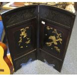 Small Japanese ebonised two fold laquer screen with applied bone decoration.