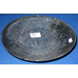 Chinese stoneware porcelain dark green/black dish with overall floral decoration. Possibly a