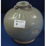 Chinese stoneware Yuan style celadon glazed, globular two-handled jar with fluted decoration.  5.