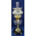 Early 20th Century brass double burner oil lamp with clear slice cut glass reservoir,