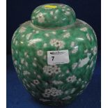 Kangxi style green glazed lidded ginger jar with overall prunus blossom decoration.  8" high approx.