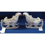 Pair of continental porcelain Troika shaped porcelain vases with gilded and floral decoration.