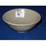 Provincial chinese celadon glazed stoneware rice bowl with fluted exterior and impressed mark to the