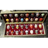 Cased set of miniature Japanese masks.