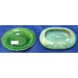 Chinese green glazed, oval brush washer decorated with relief stylised fish together with a green