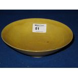 Chinese yellow glazed porcelain shallow bowl. 7" diameter. *** CONDITION REPORT: Rim chips and fits,