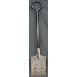 A SILVER PLATED AND EBONISED WOODEN COMMEMORATIVE SPADE presented to Miss Janet Loveluck by Mr