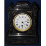 Late 19th Century black slate and marble architectural single train mantle clock with enamel face