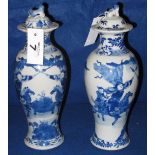 Pair of Chinese porcelain underglaze blue painted ovoid shaped lidded vases, overall decorated