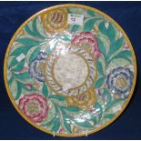 Crown Ducal china Charlotte Rhead decorated plaque overall tube lined with flower heads and foliage.