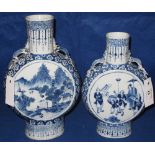 Two Chinese porcelain blue and white decorated moon flasks decorated with reserve panels of