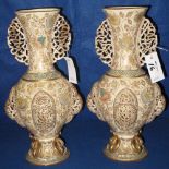 Pair of decorative Czechoslovakian pottery baluster shaped pedestal vases with pierced handles and