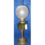 Early 20th Century brass double burner oil lamp with coloured glass fluted reservoir on brass