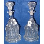Pair of late 19th Century glass ribbed mallet shaped decanters with blown stoppers.