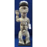 African carved poly chrome decorated wooden standing male figure.