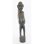 An African carved and ebonized wood tribal figure with hair. H66cm.
Reserve:€100.
In-House Packing