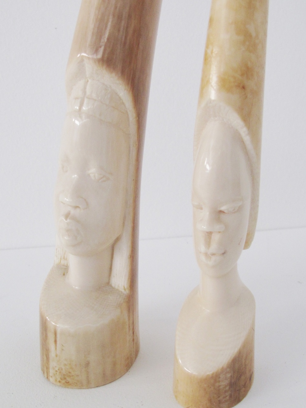 Two Tribal African carved ivory elephant tusks depicting faces. Early 20th century. L25cm and L23cm. - Image 2 of 5