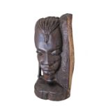 An African carved ebony bookend depicting a native woman's head. Mid 20th century. H19cm.
No