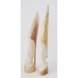 Two Tribal African carved ivory elephant tusks depicting faces. Early 20th century. L25cm and L23cm.