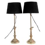 A pair of Louis XVI style gilt bronze expandable candlesticks converted to table lamps with modern