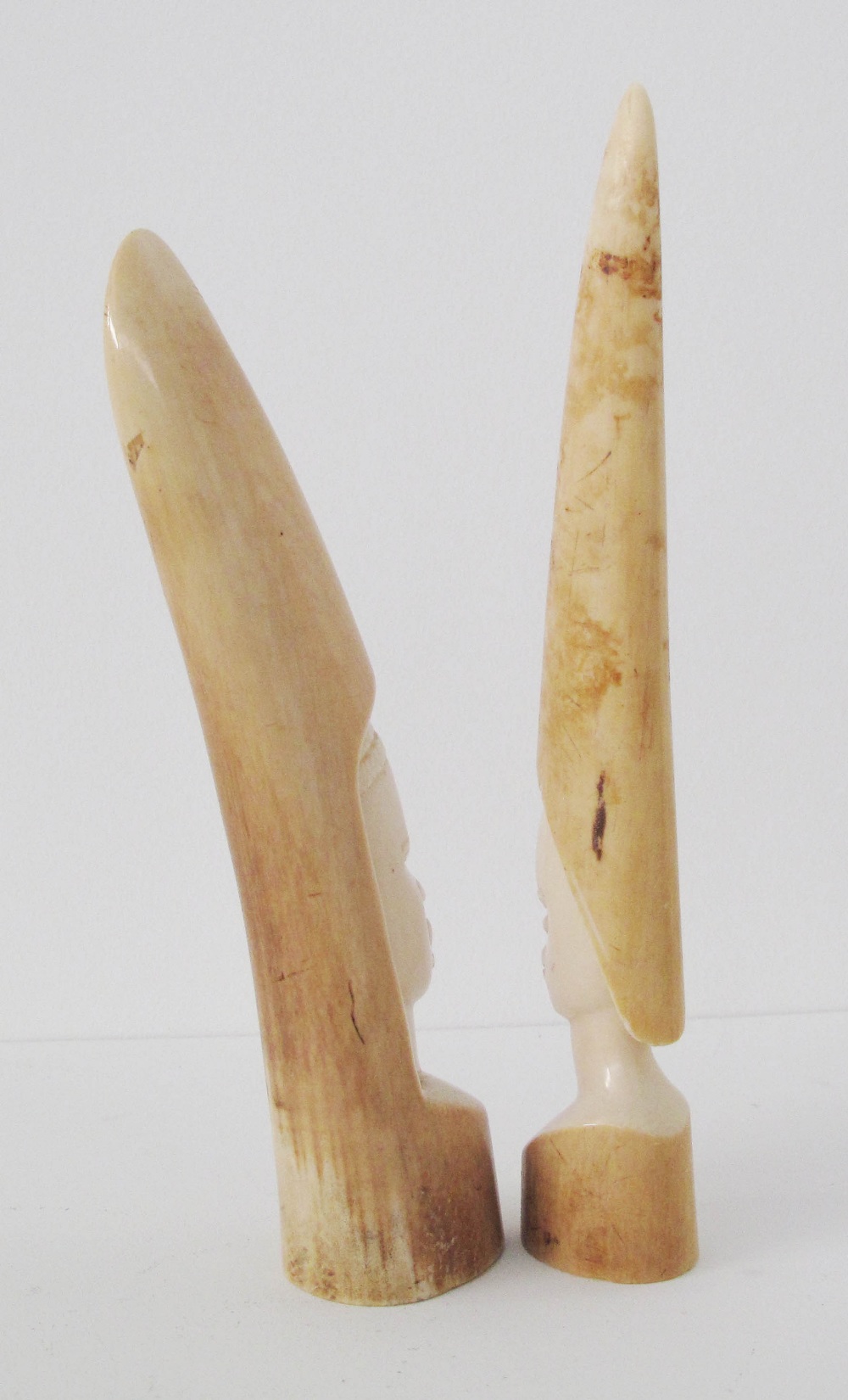 Two Tribal African carved ivory elephant tusks depicting faces. Early 20th century. L25cm and L23cm. - Image 5 of 5