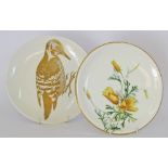 Two European porcelain chargers, 20th century. The first with yellow flower decorations, no