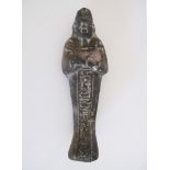 An Egyptian grey ceramic shabti - figure of a mummy. A shabti is a small human figure representing a