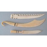 A group of three African late 19th / early 20th century carved ivory paper knives. L28cm the