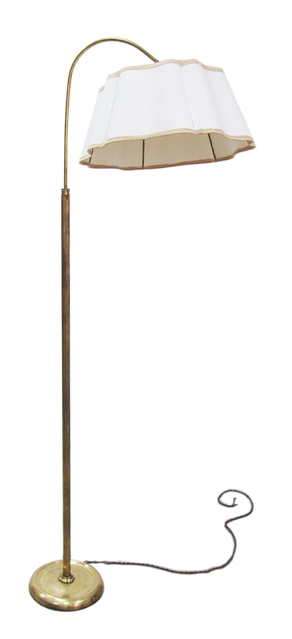 A 1950s brass floor lamp with a reeded column and adjustable cantilever head with shade. The foot