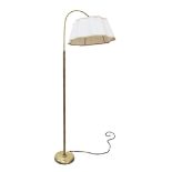 A 1950s brass floor lamp with a reeded column and adjustable cantilever head with shade. The foot