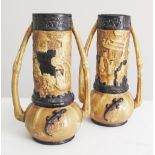 A pair of English Bretby Art pottery vases, decorated with impressed Chinese figures. Impressed