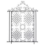 A wrought iron partition. Cypriot mid 20th century, of a geometric design with scrolls painted