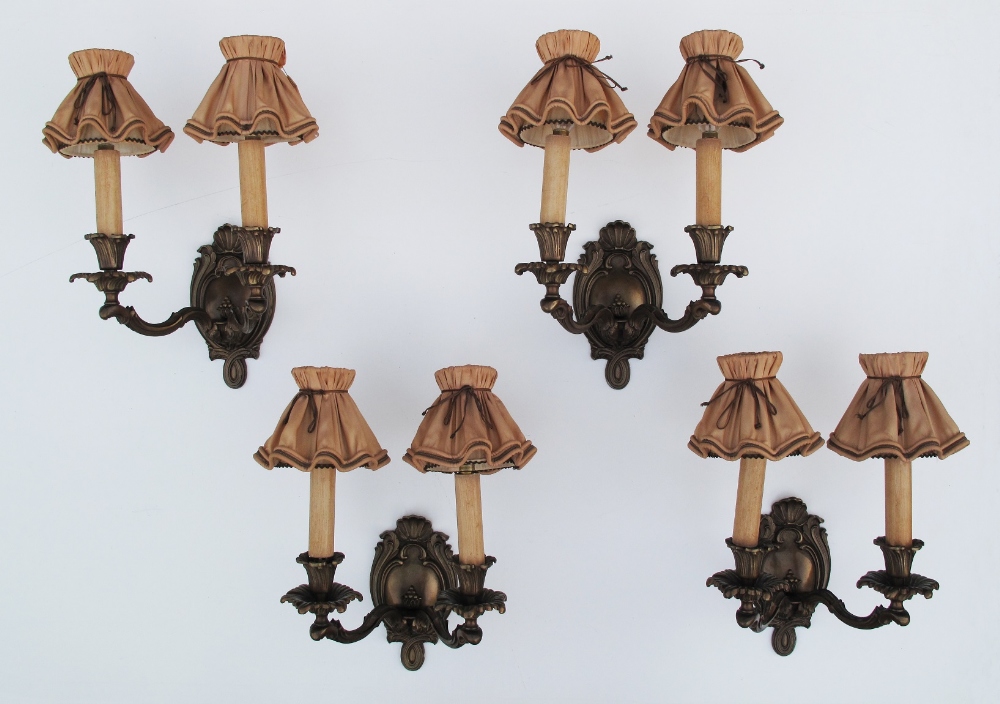 A set of four French style, exceptional quality, mid 20th century, patinated bronze two arm wall