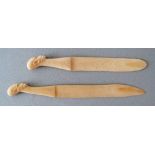 A group of two African late 19th / early 20th century carved ivory paper knives. L28cm the